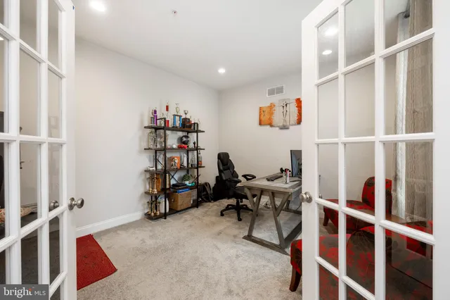 a view of a workspace with furniture