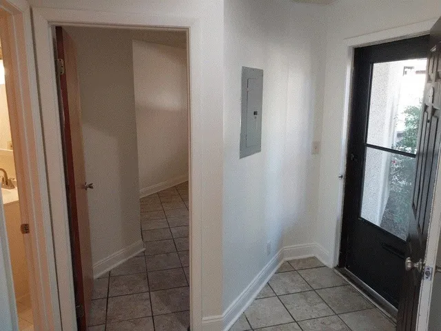 a white toilet sitting next to a bath tub