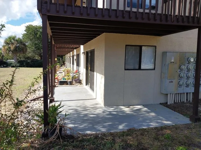 a black car parked in front of a house