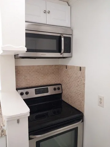 a view of a hallway with closet