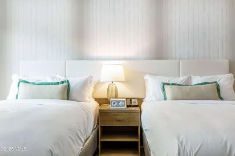 a bed room with a bed and lamp