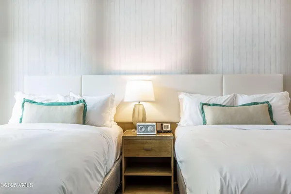 a bed room with a bed and lamp