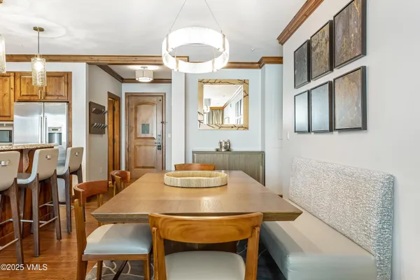 a dining room with furniture and window