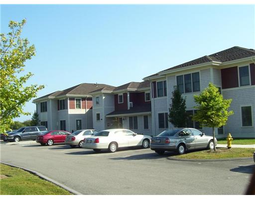 Exterior Front. Exterior view of the 190 Clarke Road building.  This building contains 10 condominium units and each unit has 2 bedrooms.  The subject property is on the first floor at the distand corner.