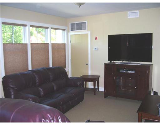 Living Room. Living room. The window shades open from either the top or from the bottom.