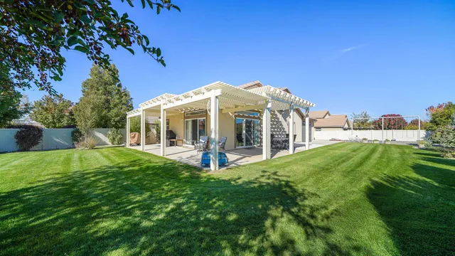 a view of a house with backyard porch and garden