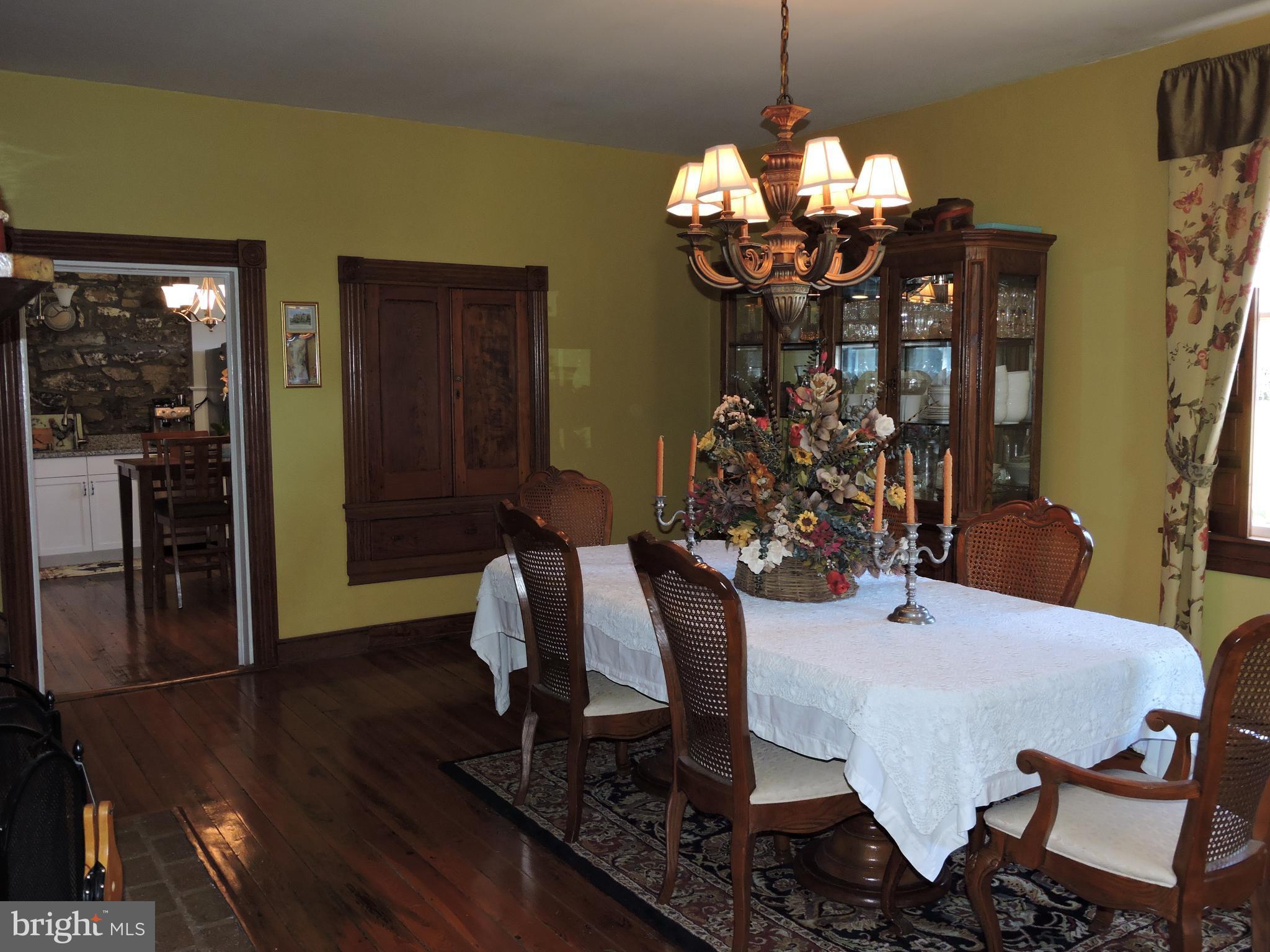 3047 Kabletown Road Charles Town, WV 25414 - Photo 11 of 30 a view of a dining room with furniture and chandelier
