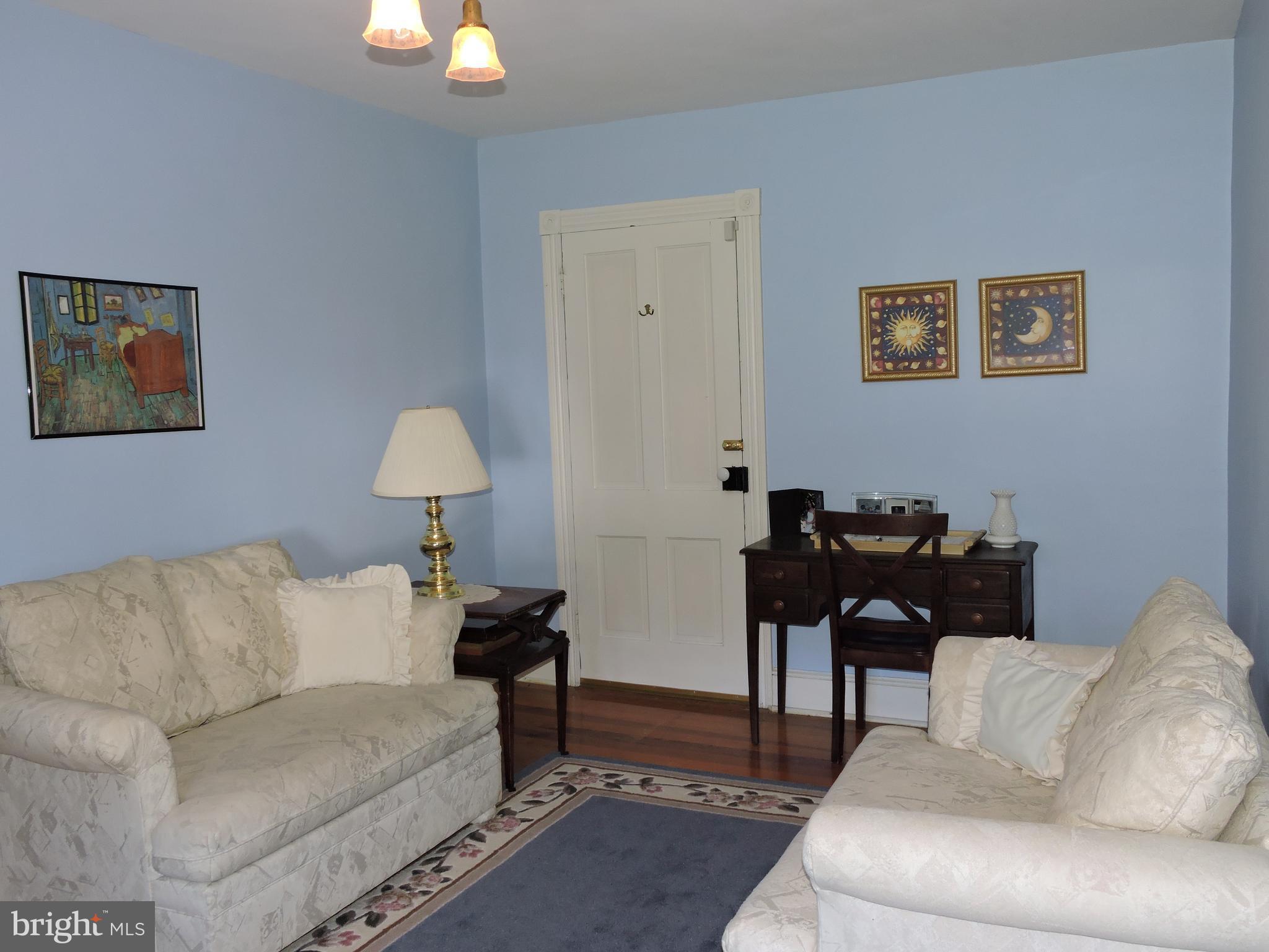 3047 Kabletown Road Charles Town, WV 25414 - Photo 18 of 30 a living room with furniture and a lamp