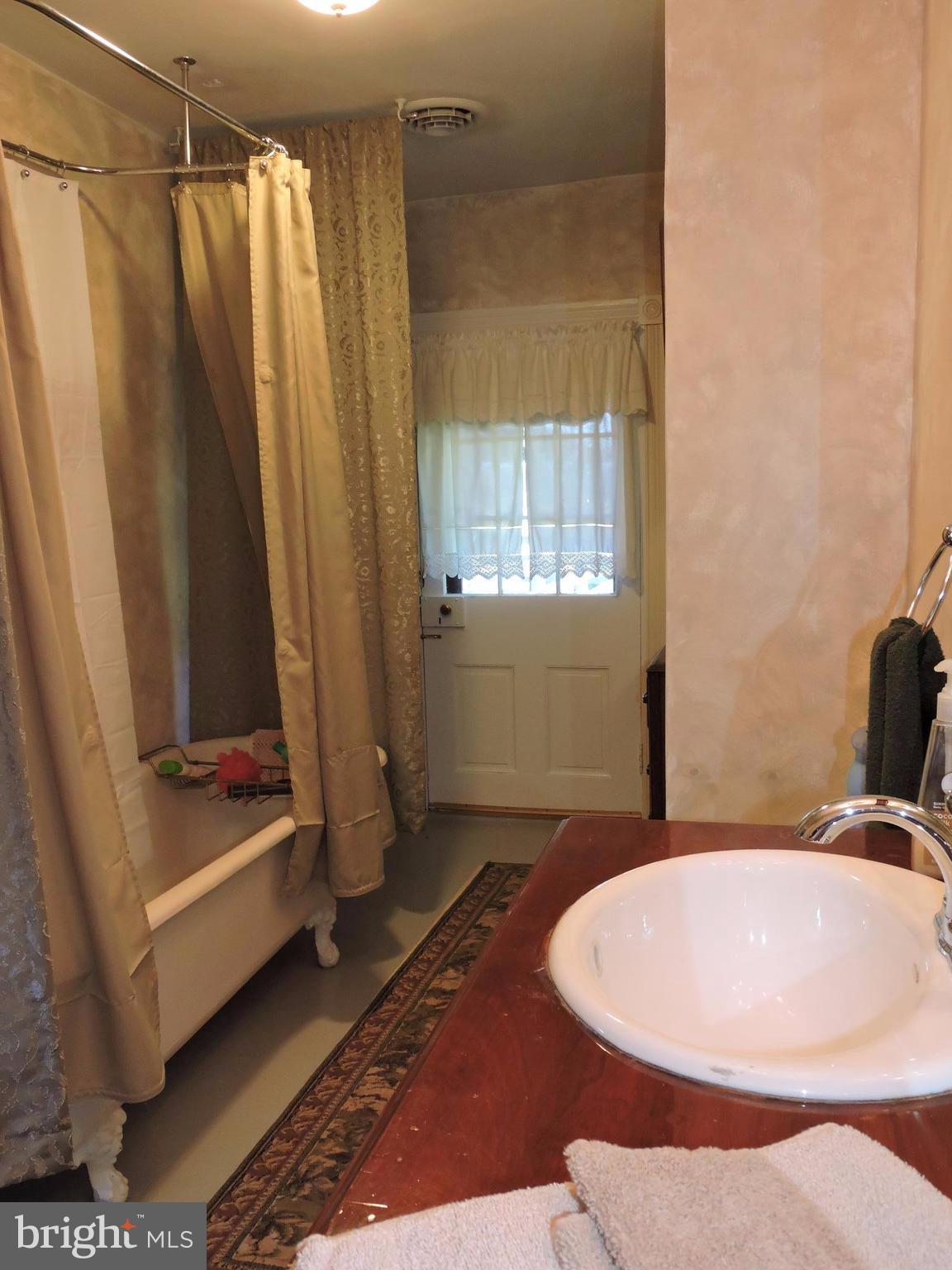 3047 Kabletown Road Charles Town, WV 25414 - Photo 20 of 30 a bathroom with a sink and a tub