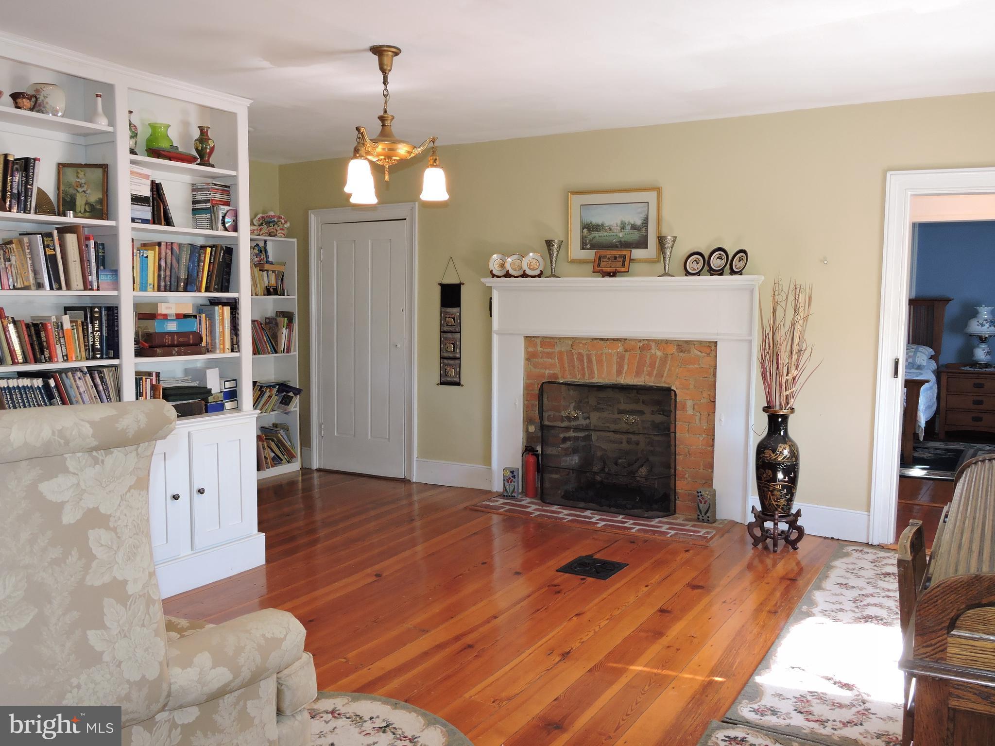 3047 Kabletown Road Charles Town, WV 25414 - Photo 21 of 30 a living room with furniture and a fireplace