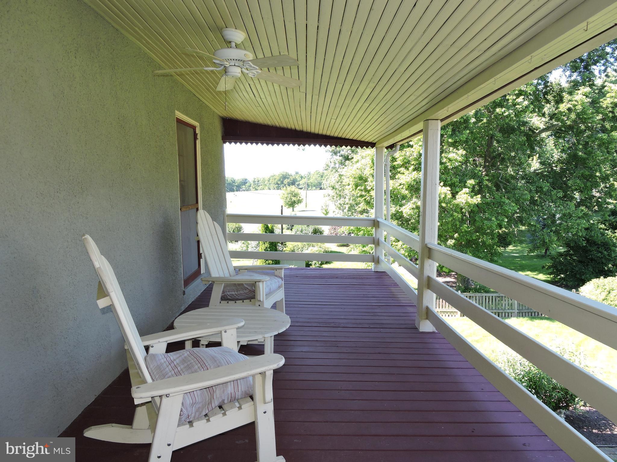 3047 Kabletown Road Charles Town, WV 25414 - Photo 25 of 30 a balcony with table and chairs