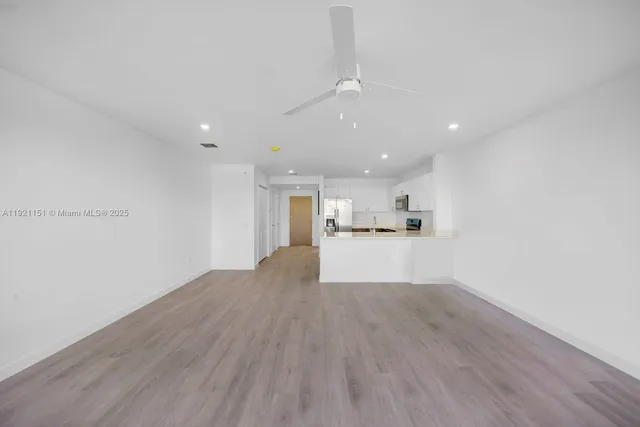 a view of kitchen with wooden floor
