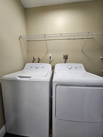 a utility room with dryer and washer