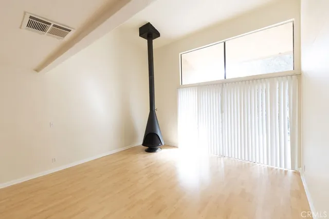 a view of a kitchen with wooden floor