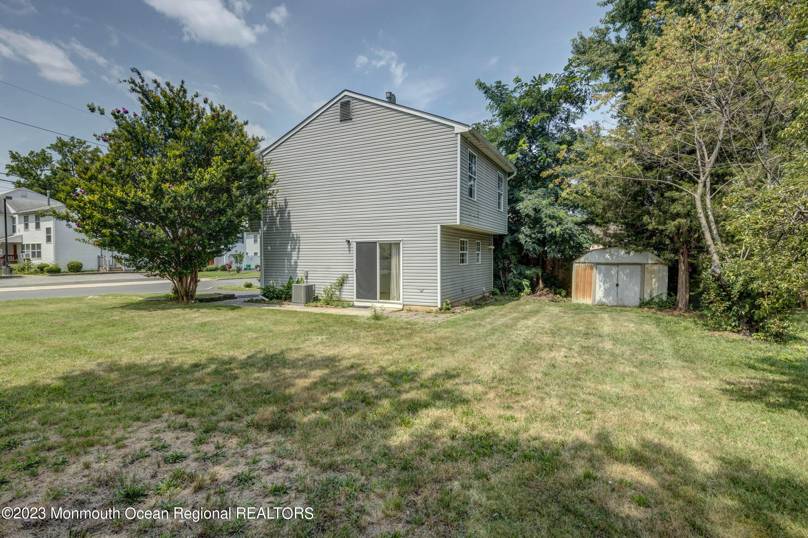 244 Raritan Street Keyport, NJ 07735 - Photo 19 of 20 a front view of a house with a yard and tree s