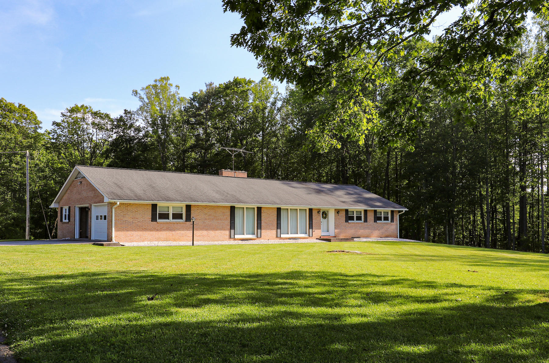 296 Kyle Weeks Road Southwest Willis, VA 24380 - Photo 1 of 35 a front view of house with yard and green space