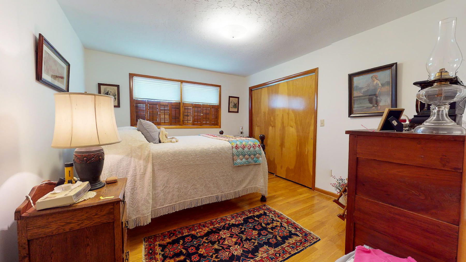 296 Kyle Weeks Road Southwest Willis, VA 24380 - Photo 16 of 35 a bedroom with a bed and wooden floor