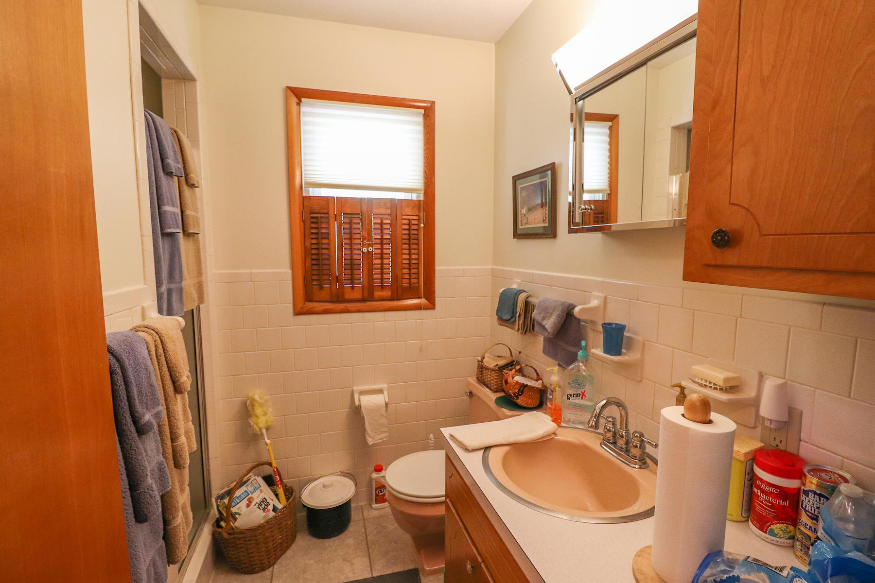 296 Kyle Weeks Road Southwest Willis, VA 24380 - Photo 18 of 35 a bathroom with a sink a toilet and a mirror