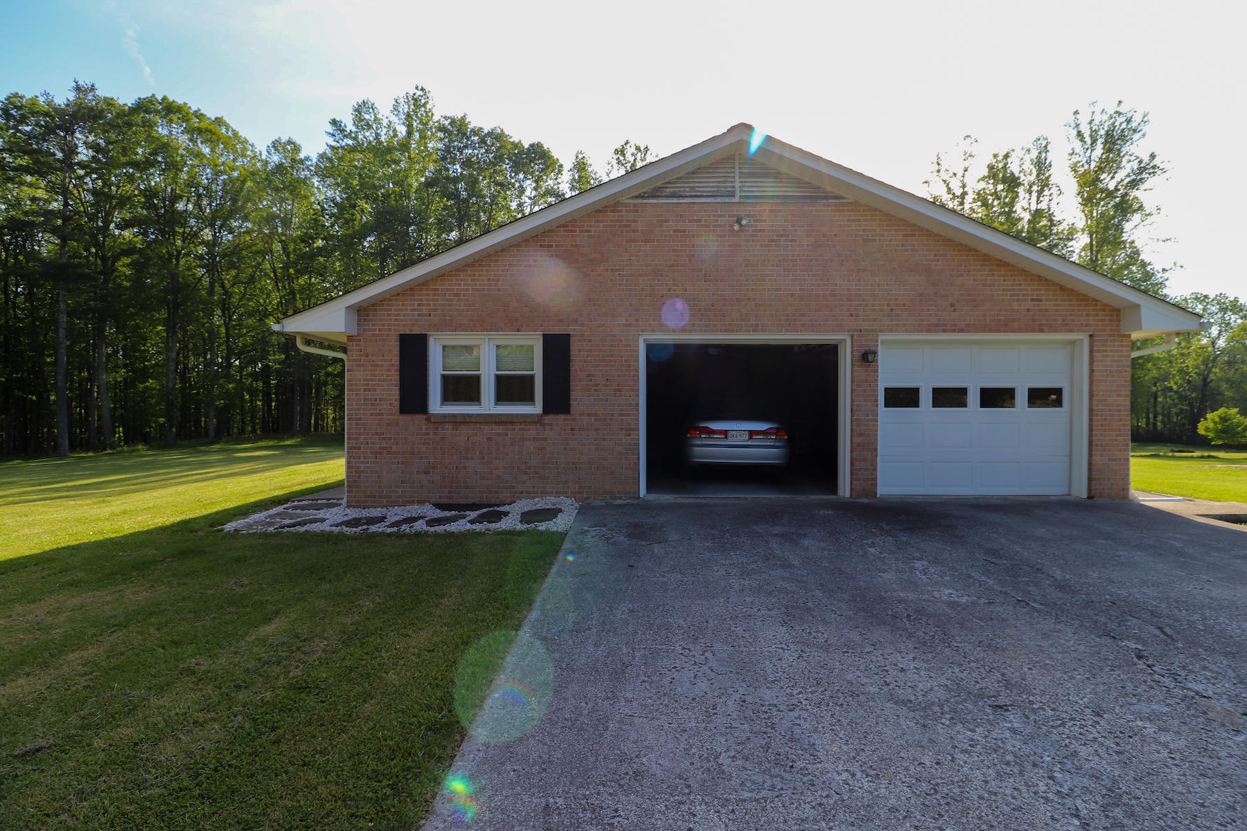 296 Kyle Weeks Road Southwest Willis, VA 24380 - Photo 3 of 35 a front view of a house with a yard and garage