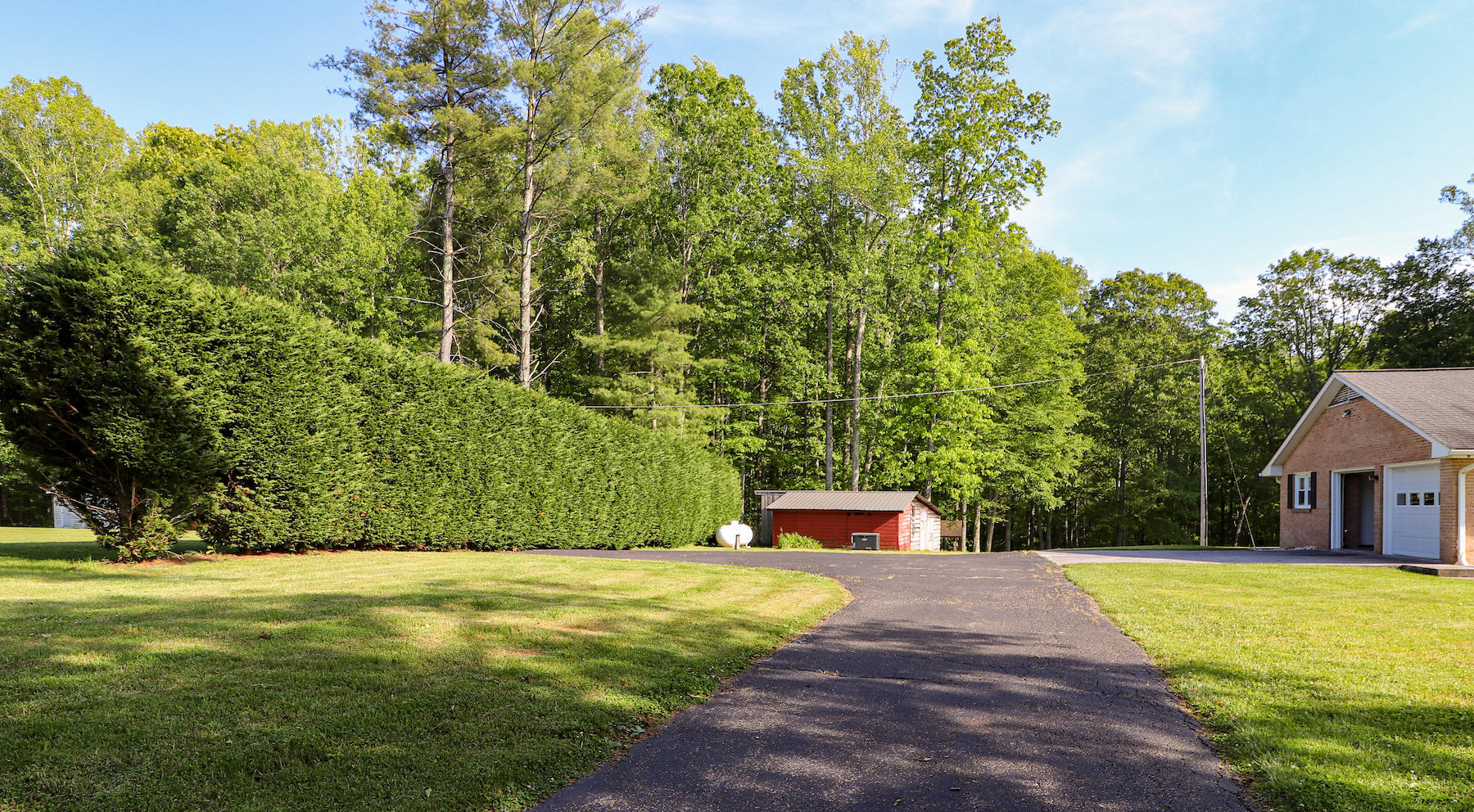 296 Kyle Weeks Road Southwest Willis, VA 24380 - Photo 34 of 35 a view of a house with a yard
