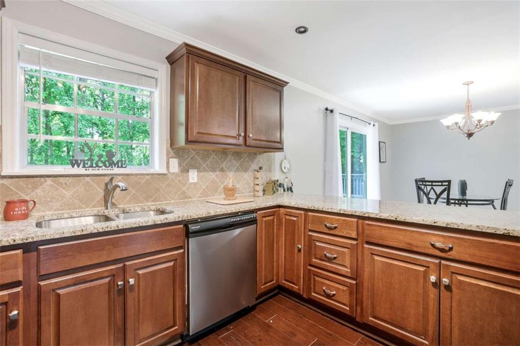 3211 Flamingo Drive East Point, GA 30344 - Photo 11 of 24 a kitchen with a sink stove and cabinets