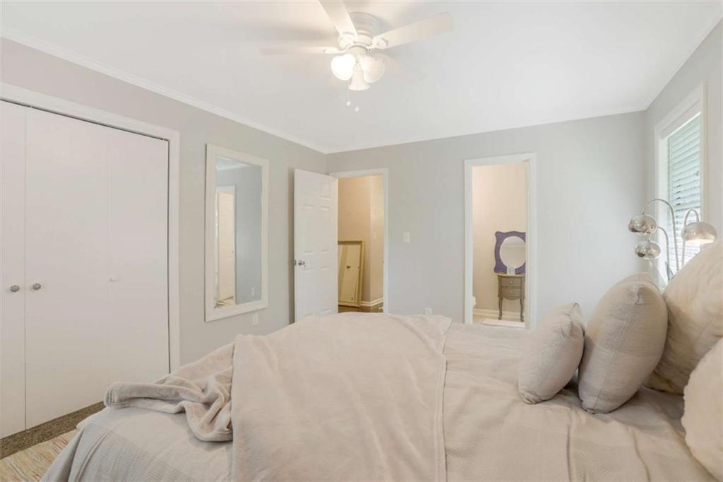 3211 Flamingo Drive East Point, GA 30344 - Photo 15 of 24 a bedroom with a bed and a chandelier