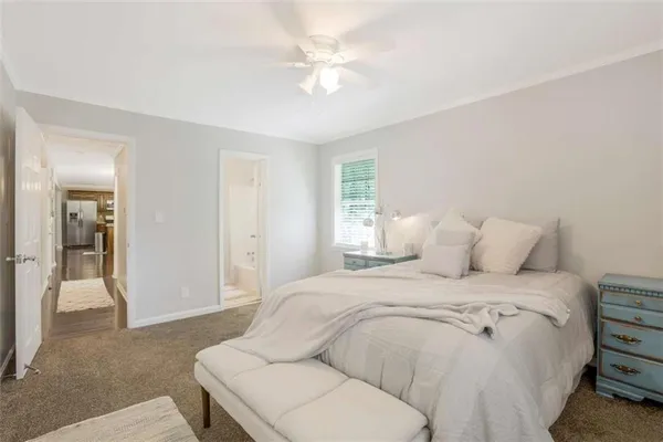 a large white bed in a white room