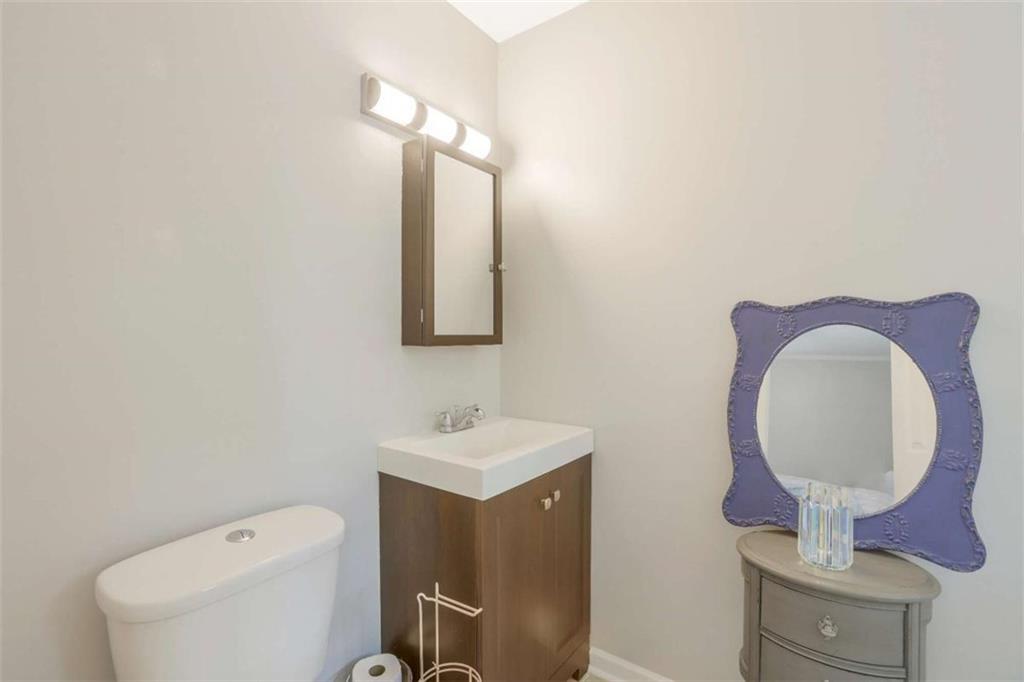 3211 Flamingo Drive East Point, GA 30344 - Photo 18 of 24 a bathroom with a toilet sink and mirror