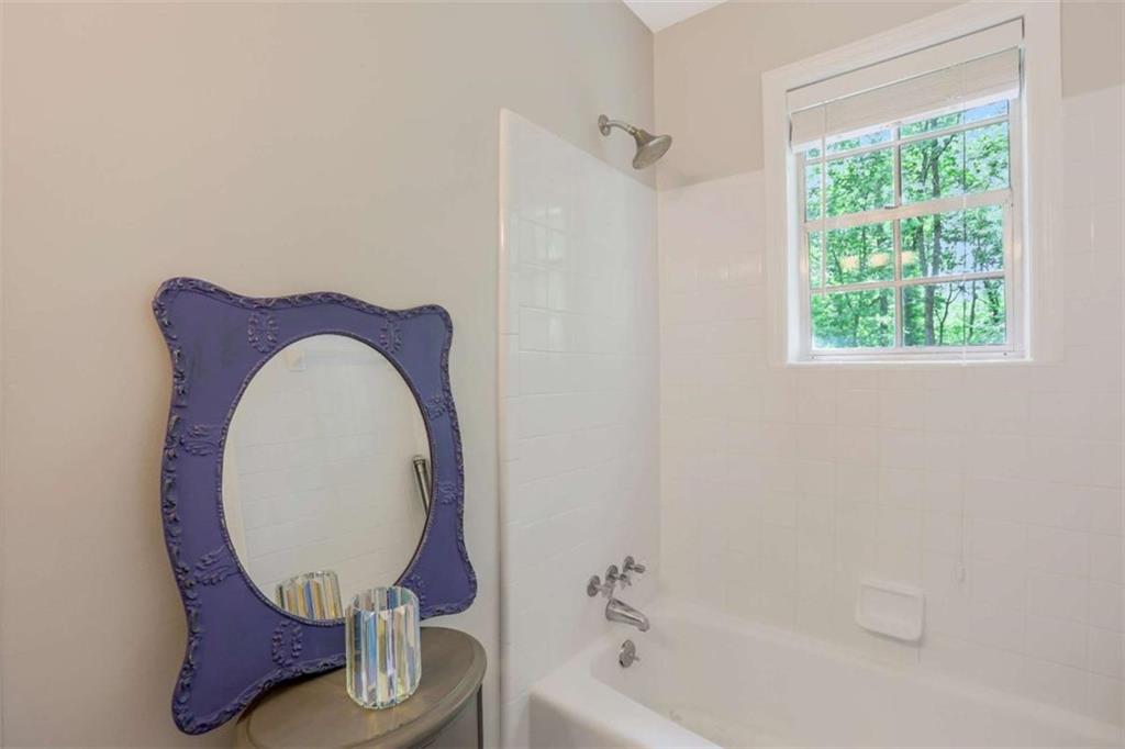 3211 Flamingo Drive East Point, GA 30344 - Photo 19 of 24 a bathroom with a toilet mirror and tub