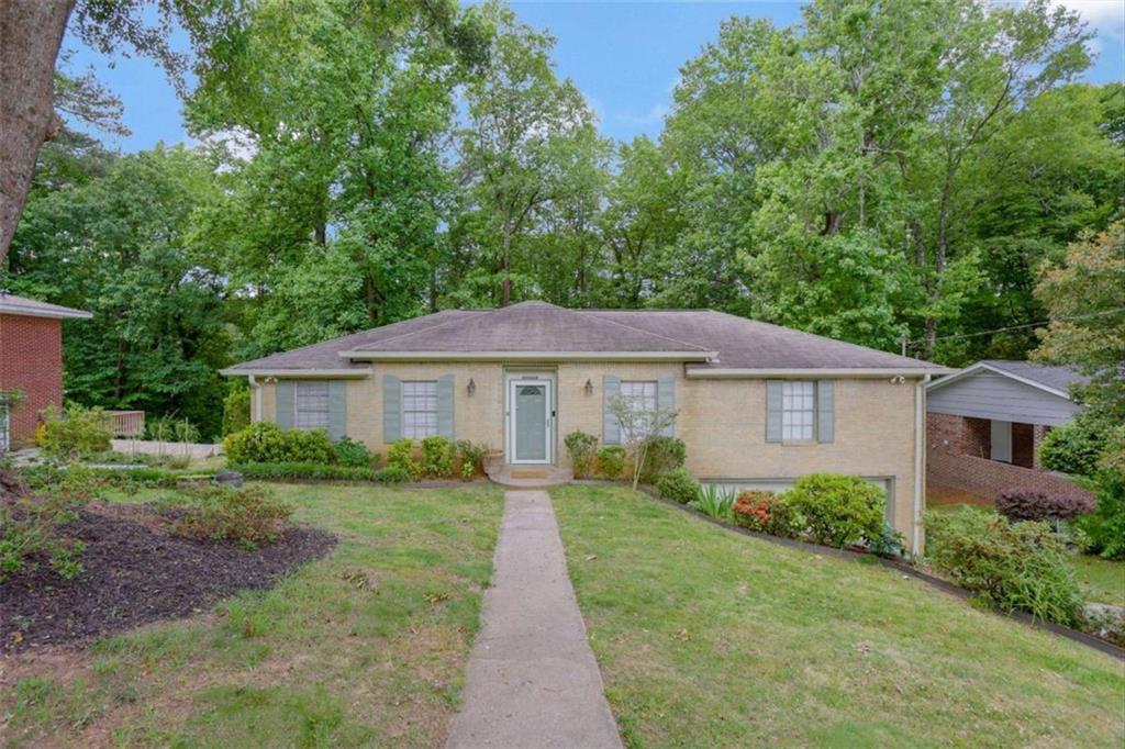 3211 Flamingo Drive East Point, GA 30344 - Photo 2 of 24 a view of a yard in front of a house with large windows