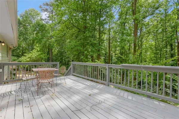 a view of balcony with deck and wooden floor