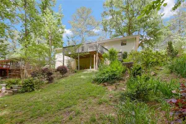 a view of a house with a yard and plants