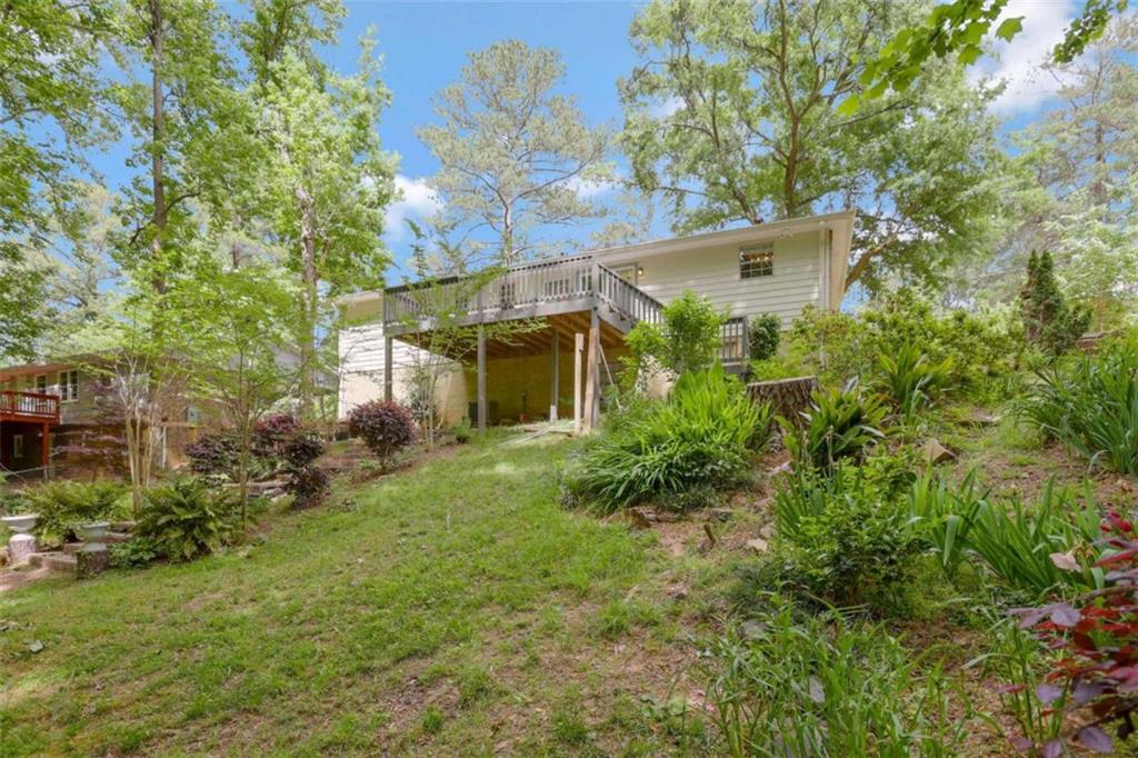 3211 Flamingo Drive East Point, GA 30344 - Photo 22 of 24 a view of a house with a yard and plants