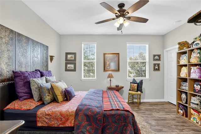 a bedroom with a bed furniture and a window