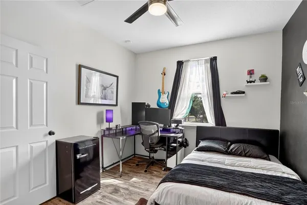 a bedroom with a bed and a window