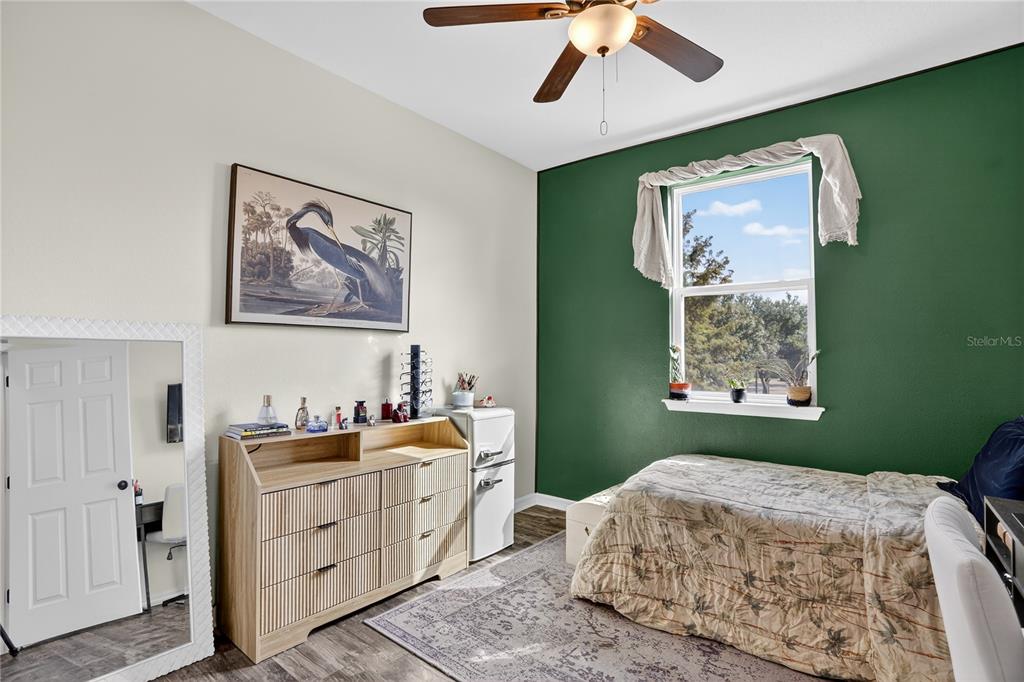 613 Fortanini Circle Ocoee, FL 34761 - Photo 17 of 24 a bedroom with a bed and a window