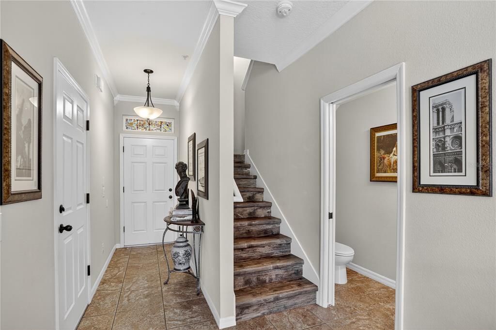 613 Fortanini Circle Ocoee, FL 34761 - Photo 2 of 24 a view of entryway and hall with wooden floor