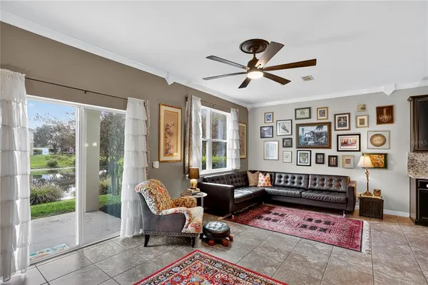 a living room with furniture windows and wooden floor