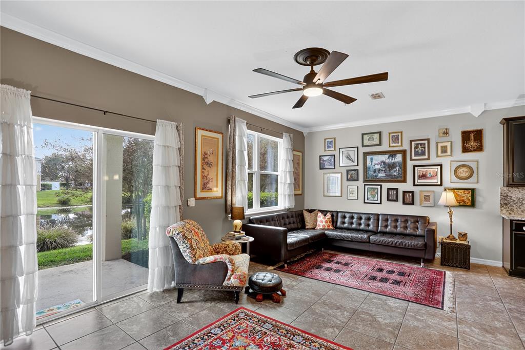 613 Fortanini Circle Ocoee, FL 34761 - Photo 7 of 24 a living room with furniture windows and wooden floor