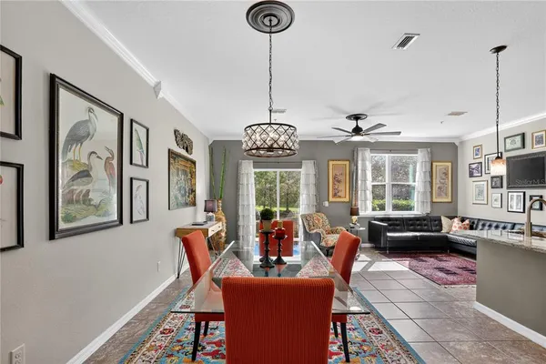a view of a dining room with furniture window and outside view