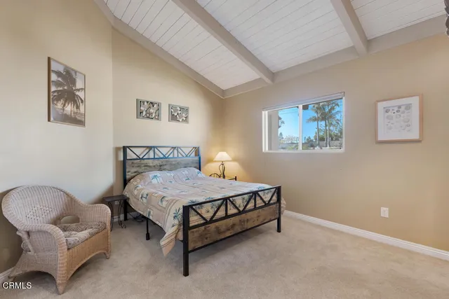a very nice looking kitchen with granite countertop a stove a sink a dining table and chairs