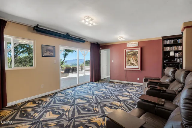 a work room with furniture and a window