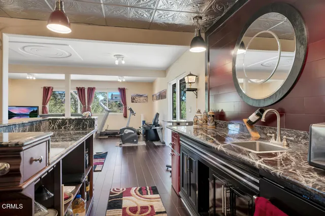 an aerial view of a house with outdoor space and street view