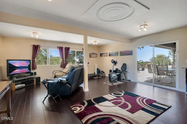 a view of a road with a house in the background