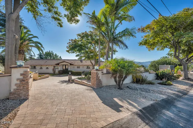 a view of a house with a street