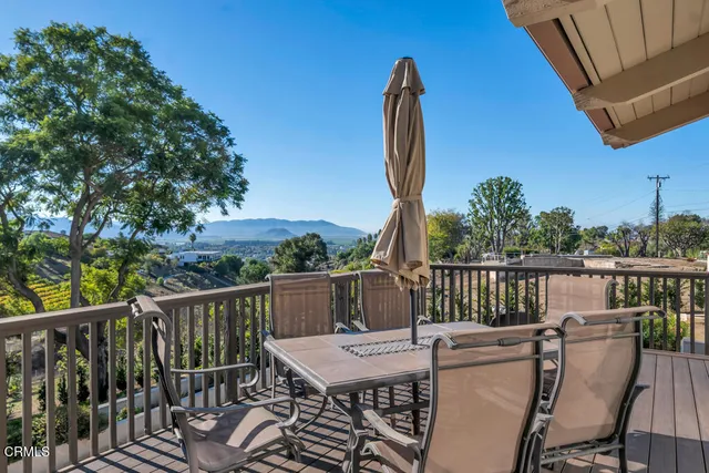 a view of a house with a mountain in the background