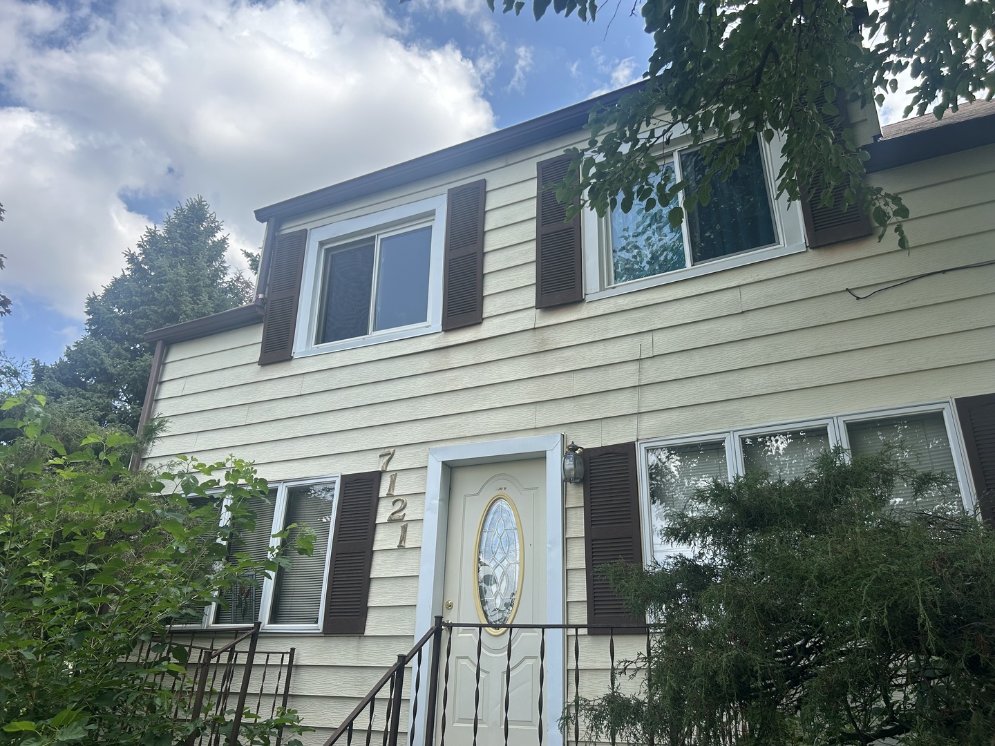 7121 South Oketo Avenue Bridgeview, IL 60455 - Photo 2 of 8 a front view of a house with garden