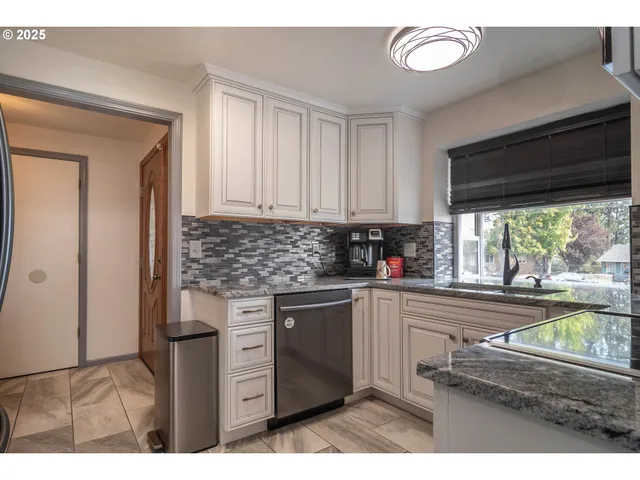 a kitchen with appliances cabinets and a sink