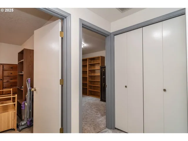 a living room with furniture and a mirror