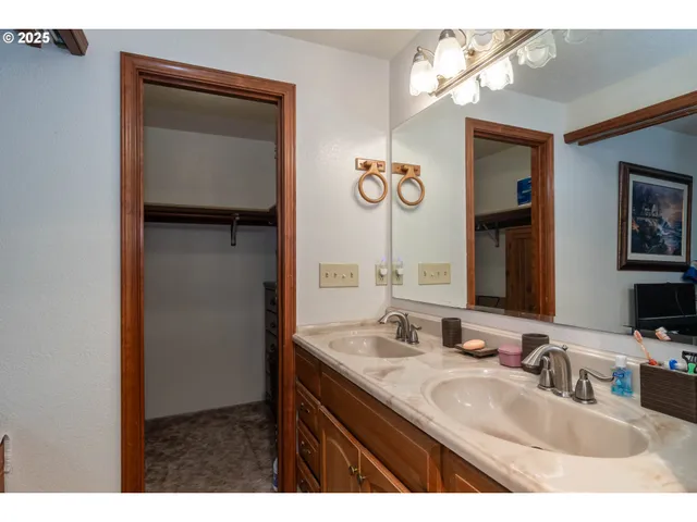 a bathroom with a sink vanity and a mirror